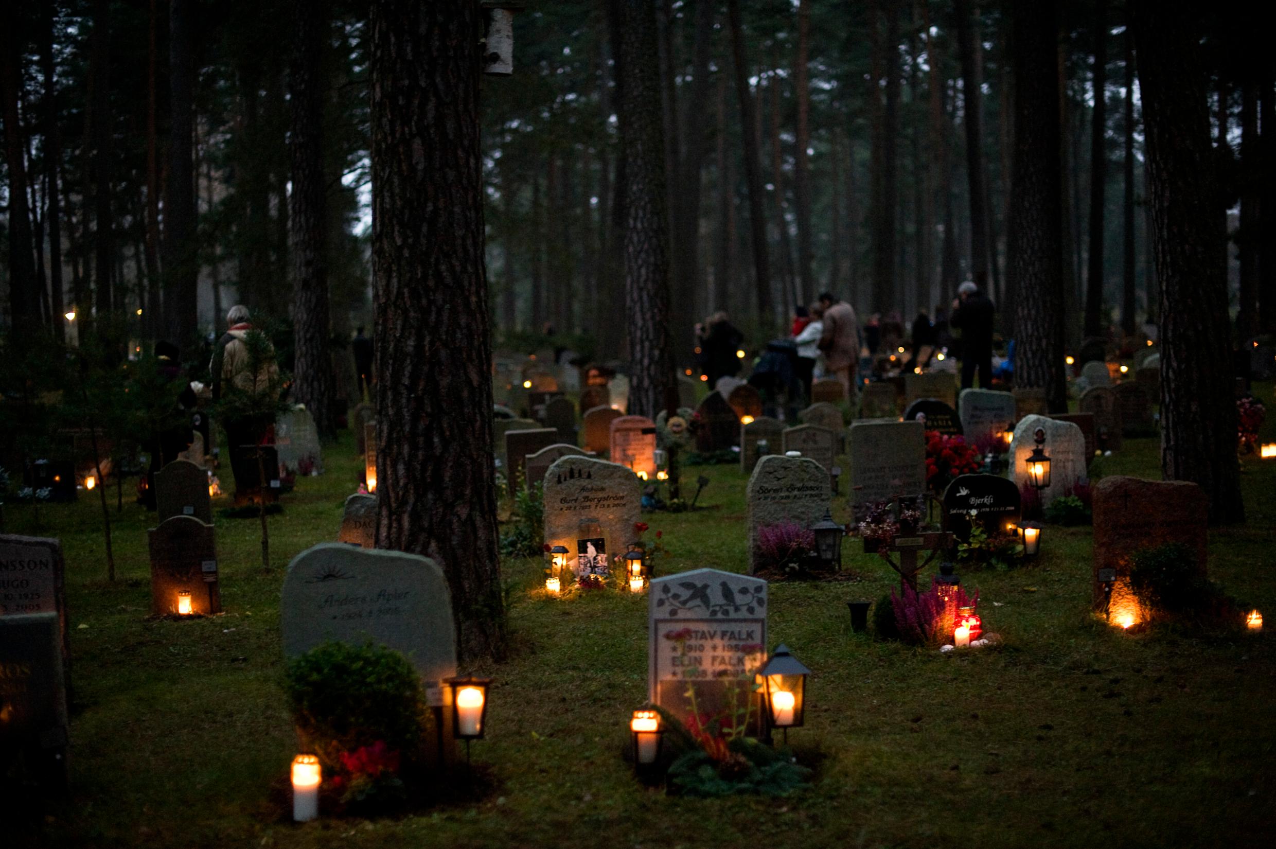 All Saints’ Day Stockholm's Woodland Cemetery lit up by candles on the graves.