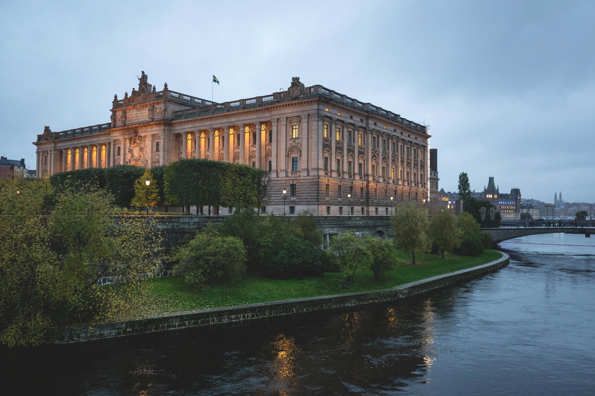 Parliament A large building by the water.